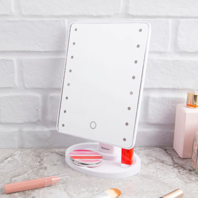 VIVITAR<sup>&reg;</sup> Lighted LED Vanity Mirror - Features 22 dimmable LED's with touch controls so you can always look your best. Includes a built-in cosmetics tray. The mirror also has 360º rotation with vertical and horizontal swivel.
